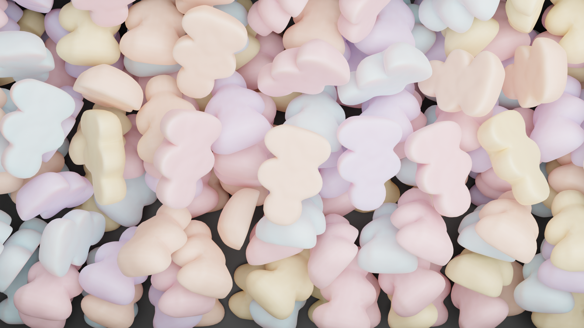 a bunch of pastel colored gummies in a tub